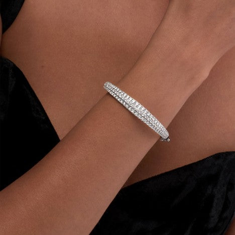 A solid gold cuff with embedded diamonds
